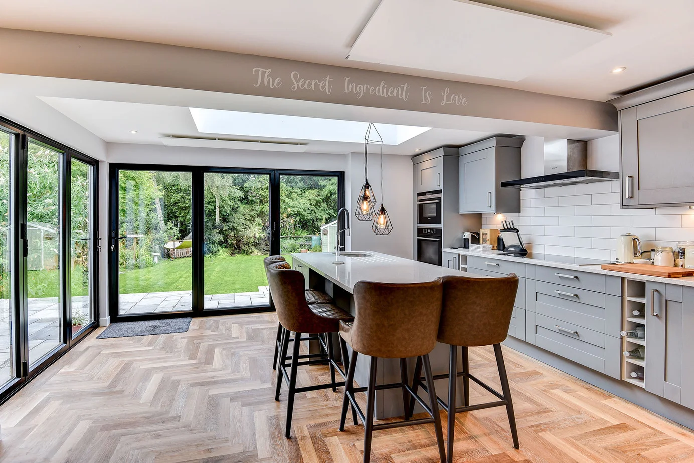 Herschel white frameless ceiling mounted XLS panels in open plan kitchen and living area